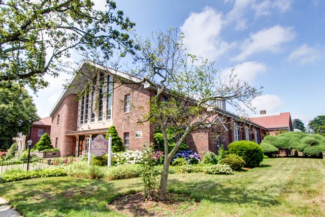 Side view of the church and lawn on a sunny day