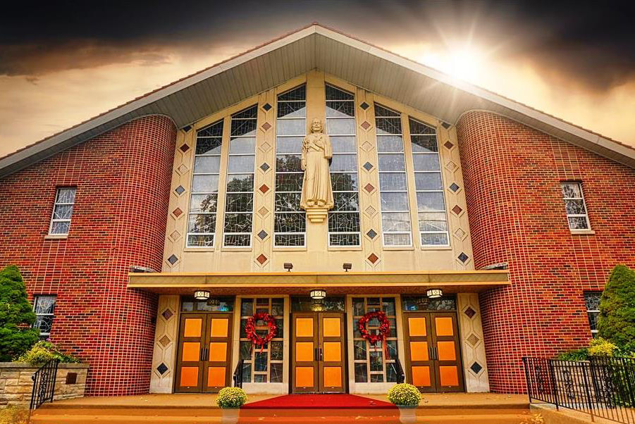 Front exterior of St. Joseph Parish adorned with wreaths