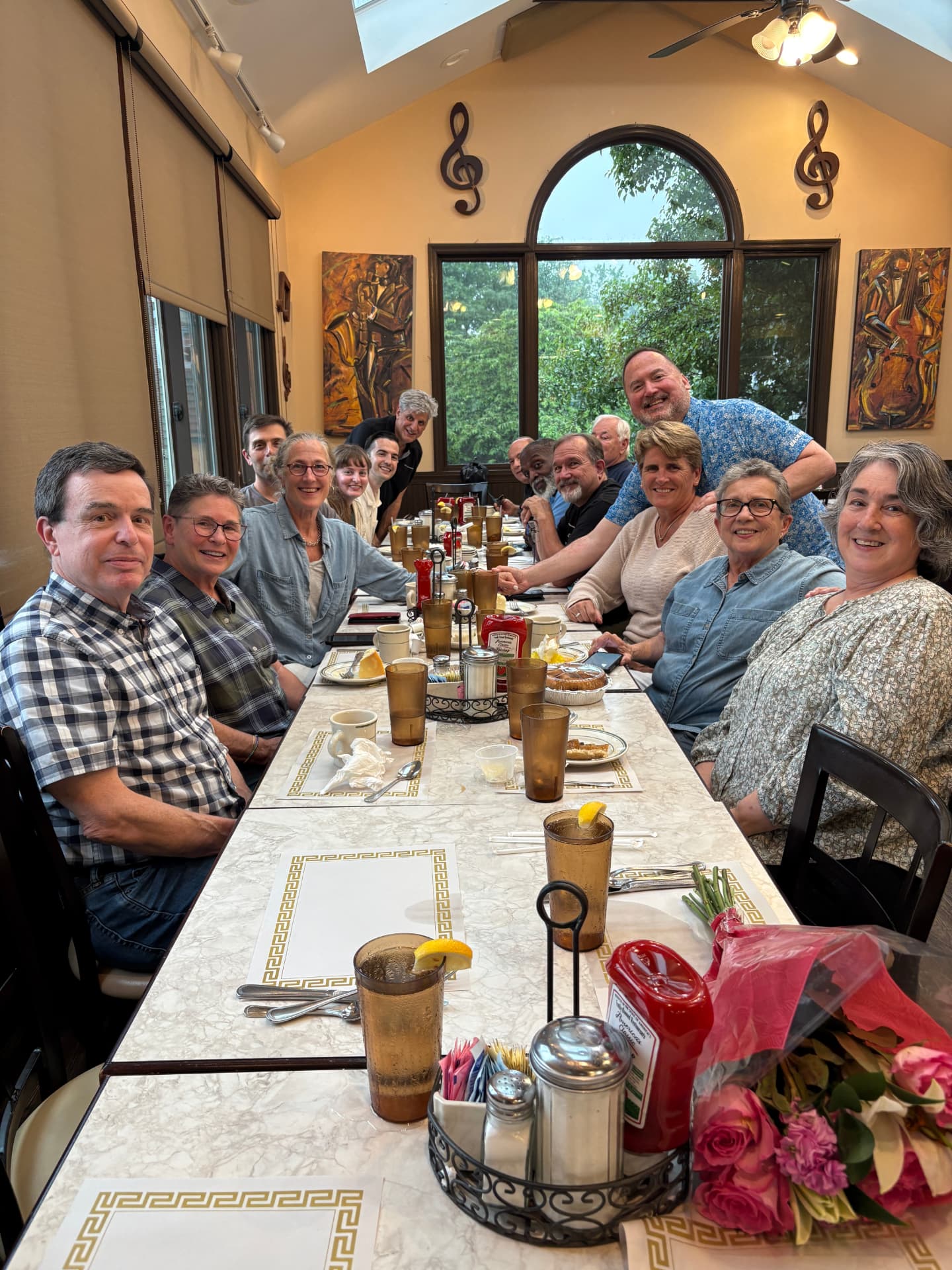 Parishioners gathered around a long table at a parish breakfast