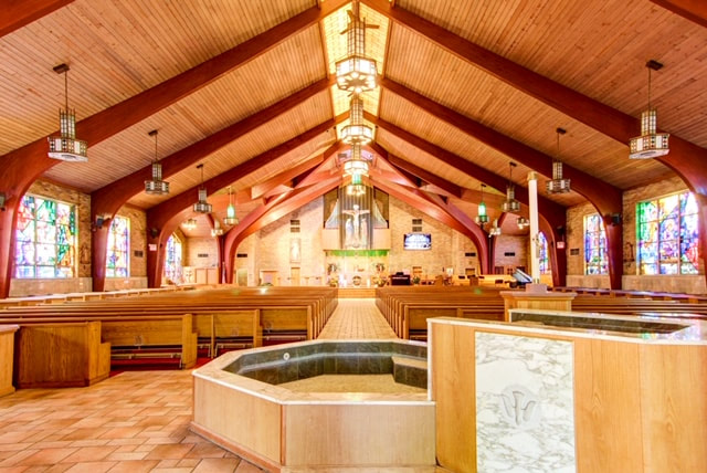 Sanctuary interior with the baptismal font in the foreground